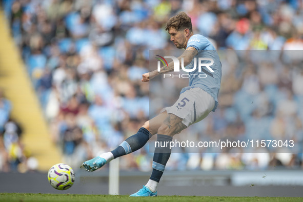 John Stones #5 of Manchester City F.C. is in action during the Premier League match between Manchester City and Brentford at the Etihad Stad...