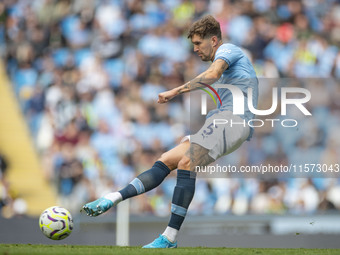 John Stones #5 of Manchester City F.C. is in action during the Premier League match between Manchester City and Brentford at the Etihad Stad...