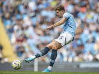 John Stones #5 of Manchester City F.C. is in action during the Premier League match between Manchester City and Brentford at the Etihad Stad...