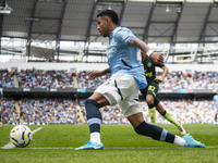 Savinho #26 of Manchester City F.C. is in action during the Premier League match between Manchester City and Brentford at the Etihad Stadium...