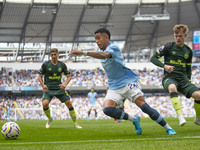 Savinho #26 of Manchester City F.C. is in action during the Premier League match between Manchester City and Brentford at the Etihad Stadium...