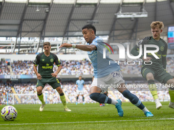 Savinho #26 of Manchester City F.C. is in action during the Premier League match between Manchester City and Brentford at the Etihad Stadium...