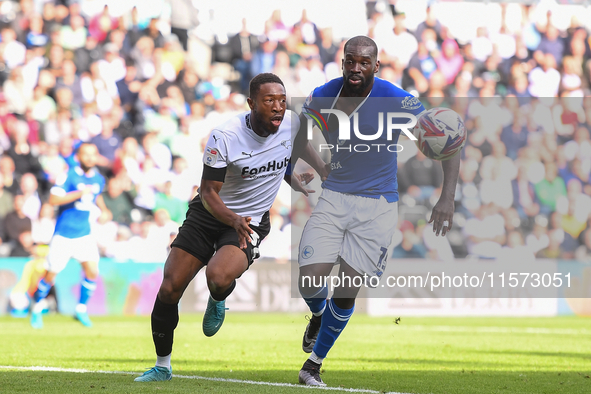 Ebou Adams of Derby County battles with Wilfried Kanga of Cardiff City during the Sky Bet Championship match between Derby County and Cardif...