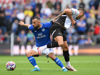 Manolis Siopis of Cardiff City battles with Jerry Yates of Derby County during the Sky Bet Championship match between Derby County and Cardi...