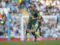 Mikkel Damsgaard #24 of Brentford F.C. during the Premier League match between Manchester City and Brentford at the Etihad Stadium in Manche...