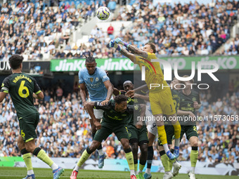 Mark Fleckken #1 (GK) of Brentford F.C. makes a save during the Premier League match between Manchester City and Brentford at the Etihad Sta...