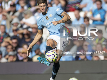 John Stones #5 of Manchester City F.C. during the Premier League match between Manchester City and Brentford at the Etihad Stadium in Manche...