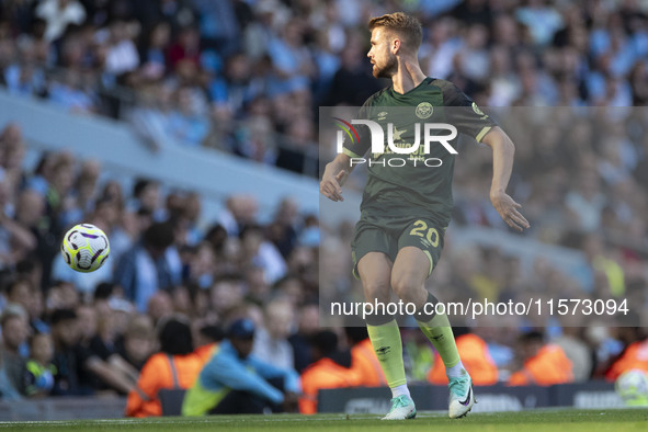 Kristoffer Ajer #20 of Brentford F.C. during the Premier League match between Manchester City and Brentford at the Etihad Stadium in Manches...