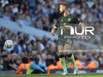 Kristoffer Ajer #20 of Brentford F.C. during the Premier League match between Manchester City and Brentford at the Etihad Stadium in Manches...