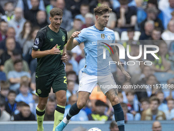 John Stones #5 of Manchester City F.C. during the Premier League match between Manchester City and Brentford at the Etihad Stadium in Manche...