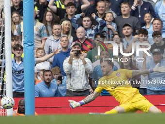 Mark Fleckken #1 (GK) of Brentford F.C. makes a save during the Premier League match between Manchester City and Brentford at the Etihad Sta...