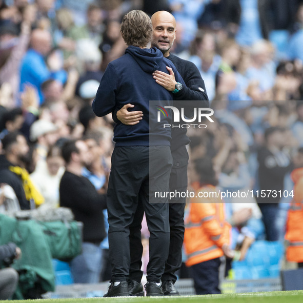 Manchester City F.C. manager Pep Guardiola and Brentford F.C. manager Thomas Franks shake hands at full time during the Premier League match...