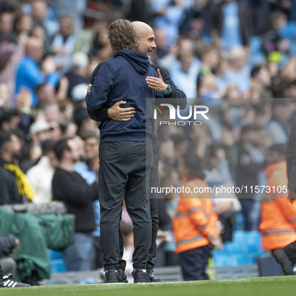 Manchester City F.C. manager Pep Guardiola and Brentford F.C. manager Thomas Franks shake hands at full time during the Premier League match...