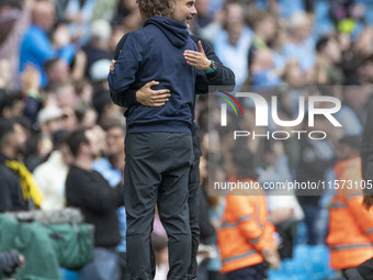 Manchester City F.C. manager Pep Guardiola and Brentford F.C. manager Thomas Franks shake hands at full time during the Premier League match...