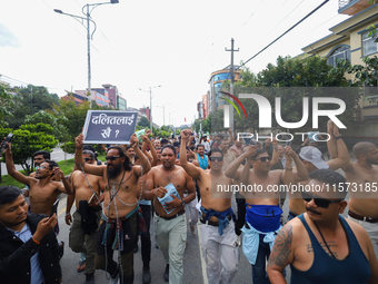 Dalit rights activists hold a shirtless demonstration in Kathmandu, Nepal, on September 14, 2024. The protest, initiated by Khagendra Sunar,...