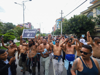 Dalit rights activists hold a shirtless demonstration in Kathmandu, Nepal, on September 14, 2024. The protest, initiated by Khagendra Sunar,...