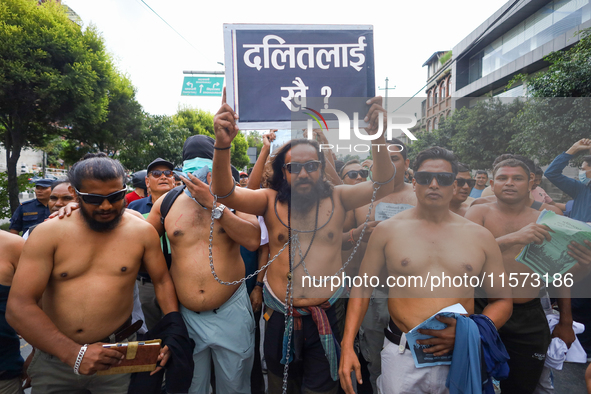 Dalit rights activists hold a shirtless demonstration in Kathmandu, Nepal, on September 14, 2024. The protest, initiated by Khagendra Sunar,...