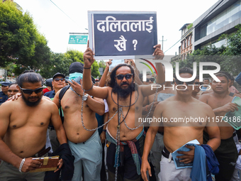 Dalit rights activists hold a shirtless demonstration in Kathmandu, Nepal, on September 14, 2024. The protest, initiated by Khagendra Sunar,...