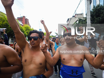 Dalit rights activists hold a shirtless demonstration in Kathmandu, Nepal, on September 14, 2024. The protest, initiated by Khagendra Sunar,...