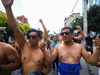 Dalit rights activists hold a shirtless demonstration in Kathmandu, Nepal, on September 14, 2024. The protest, initiated by Khagendra Sunar,...