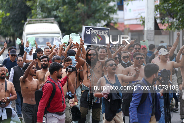 Dalit rights activists hold a shirtless demonstration in Kathmandu, Nepal, on September 14, 2024. The protest, initiated by Khagendra Sunar,...