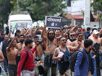 Dalit rights activists hold a shirtless demonstration in Kathmandu, Nepal, on September 14, 2024. The protest, initiated by Khagendra Sunar,...