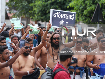 Dalit rights activists hold a shirtless demonstration in Kathmandu, Nepal, on September 14, 2024. The protest, initiated by Khagendra Sunar,...