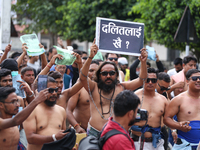 Dalit rights activists hold a shirtless demonstration in Kathmandu, Nepal, on September 14, 2024. The protest, initiated by Khagendra Sunar,...