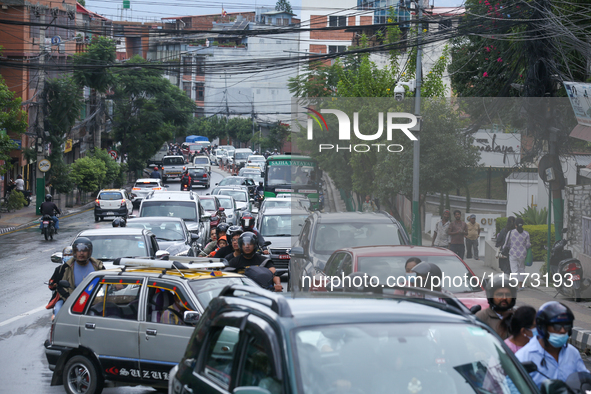 A section of road caves in after a water supply pipe malfunctions in Lalitpur, Nepal, on September 14, 2024. The incidents of roads caving i...