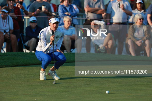 GAINESVILLE, VIRGINIA - SEPTEMBER 14: Esther Henseleit of Team Europe lines up her putt on the third green during Foursome Matches on Day Tw...