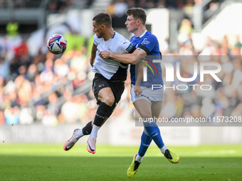 Jerry Yates of Derby County battles with William Fish of Cardiff City during the Sky Bet Championship match between Derby County and Cardiff...