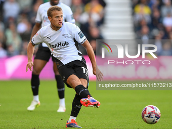 Kenzo Goudmijn of Derby County passes the ball during the Sky Bet Championship match between Derby County and Cardiff City at Pride Park in...