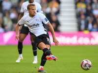 Kenzo Goudmijn of Derby County passes the ball during the Sky Bet Championship match between Derby County and Cardiff City at Pride Park in...