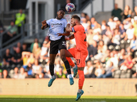 Ebou Adams of Derby County clashes with Jak Alnwick, Cardiff City goalkeeper, during the Sky Bet Championship match between Derby County and...