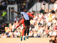 Ebou Adams of Derby County clashes with Jak Alnwick, Cardiff City goalkeeper, during the Sky Bet Championship match between Derby County and...