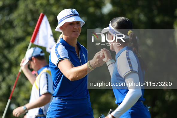 GAINESVILLE, VIRGINIA - SEPTEMBER 14:  Anna Nordqvist of Team Europe celebrates her putt on the 8th green with teammate Celine Boutier durin...