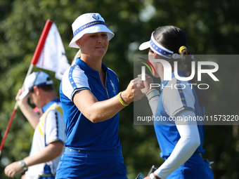 GAINESVILLE, VIRGINIA - SEPTEMBER 14:  Anna Nordqvist of Team Europe celebrates her putt on the 8th green with teammate Celine Boutier durin...