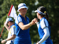 GAINESVILLE, VIRGINIA - SEPTEMBER 14:  Anna Nordqvist of Team Europe celebrates her putt on the 8th green with teammate Celine Boutier durin...