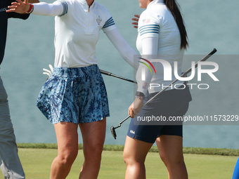 GAINESVILLE, VIRGINIA - SEPTEMBER 14: Nelly Korda of the United States celebrates with teammate Allisen Corpuz on the 18th green during Four...