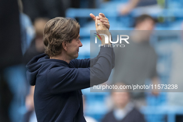 Brentford F.C. manager Thomas Franks applauds at full time during the Premier League match between Manchester City and Brentford at the Etih...