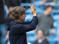 Brentford F.C. manager Thomas Franks applauds at full time during the Premier League match between Manchester City and Brentford at the Etih...