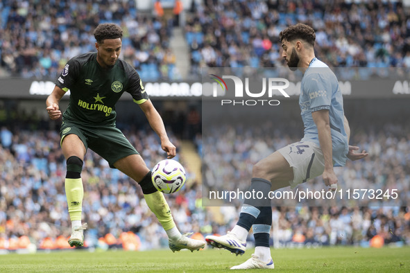 Josko Gvardiol #24 of Manchester City F.C. tackles the opponent during the Premier League match between Manchester City and Brentford at the...