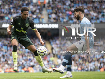 Josko Gvardiol #24 of Manchester City F.C. tackles the opponent during the Premier League match between Manchester City and Brentford at the...