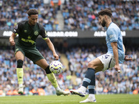 Josko Gvardiol #24 of Manchester City F.C. tackles the opponent during the Premier League match between Manchester City and Brentford at the...