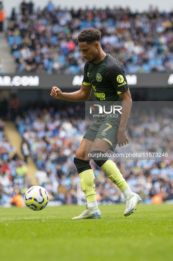 Kevin Schade #7 of Brentford F.C. is in action during the Premier League match between Manchester City and Brentford at the Etihad Stadium i...