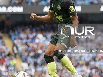 Kevin Schade #7 of Brentford F.C. is in action during the Premier League match between Manchester City and Brentford at the Etihad Stadium i...