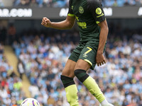 Kevin Schade #7 of Brentford F.C. is in action during the Premier League match between Manchester City and Brentford at the Etihad Stadium i...