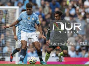 Rodri #16 of Manchester City F.C. is in possession of the ball during the Premier League match between Manchester City and Brentford at the...