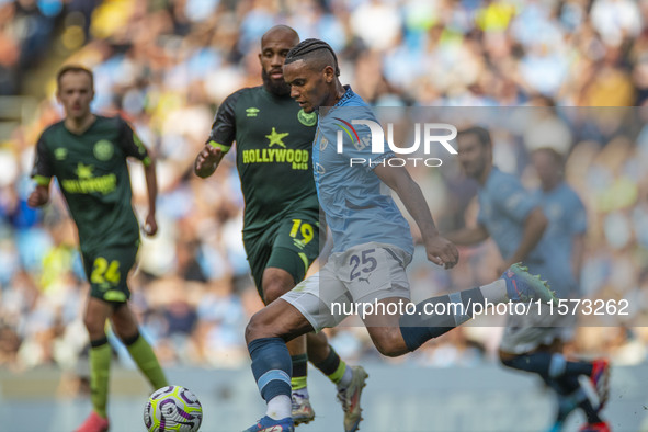 Manuel Akanji #25 of Manchester City F.C. is in action during the Premier League match between Manchester City and Brentford at the Etihad S...