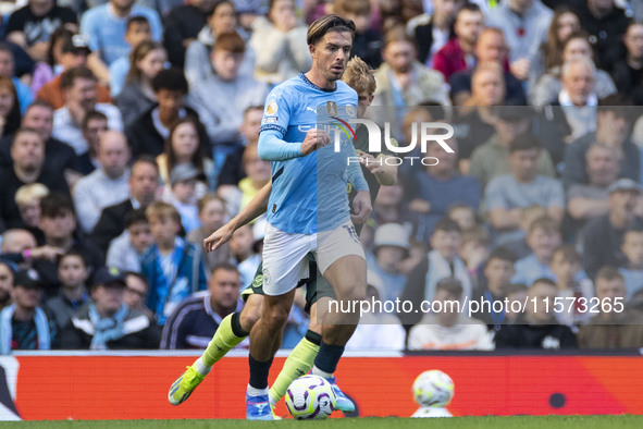 Jack Grealish #10 of Manchester City F.C. is in action during the Premier League match between Manchester City and Brentford at the Etihad S...